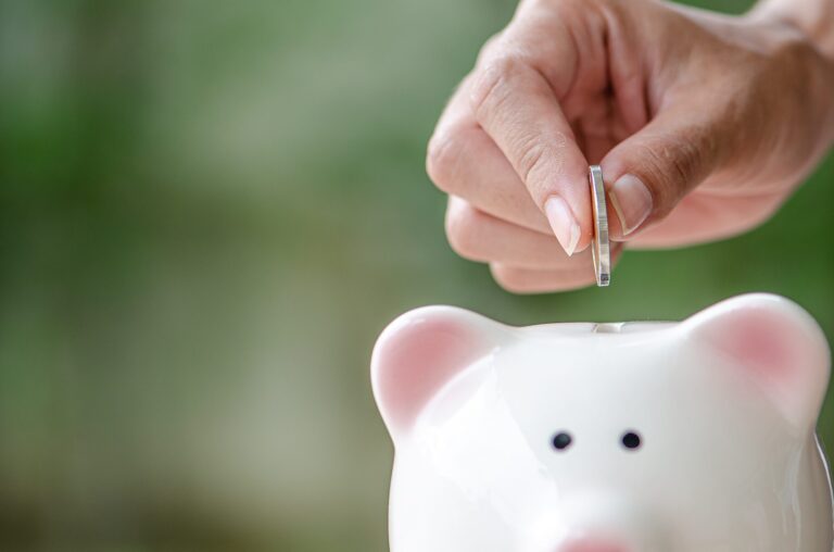 piggy-bank-for-investment-save-money-or-retire-in-future-with-blue-background-and-copy-space-e1741524940594 Image description